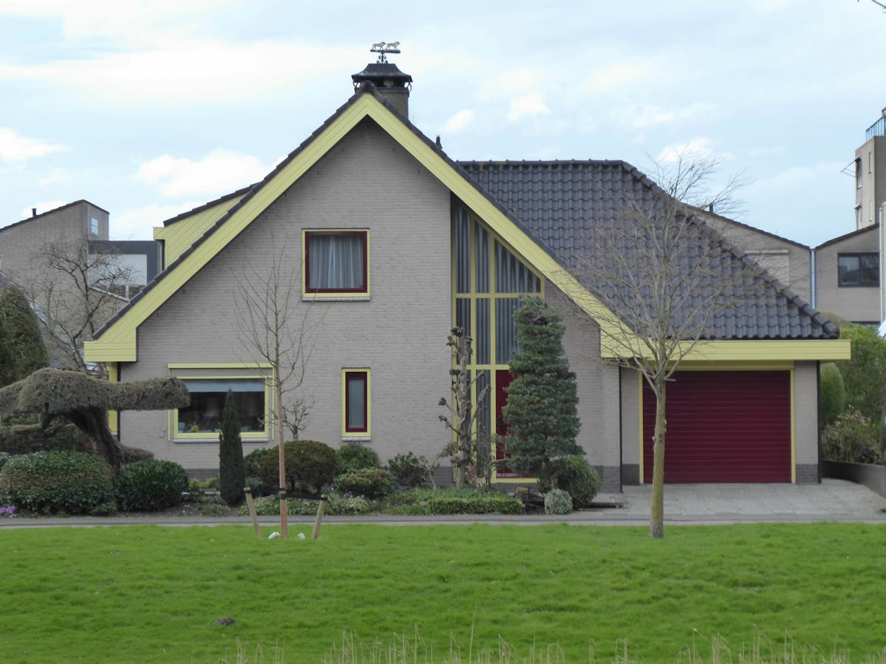 Home Contemporary house in suburb with vibrant yard and garage.