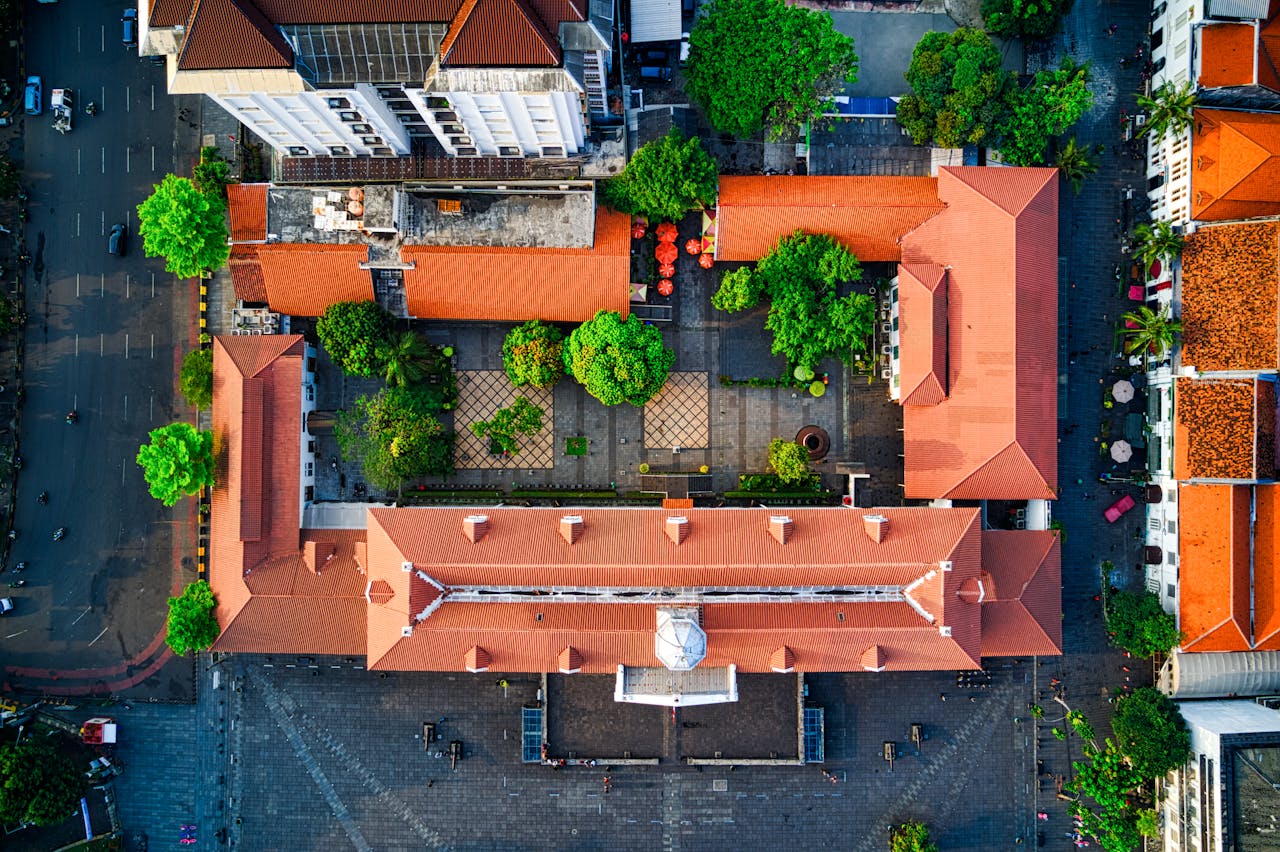 Services Drone shot of a traditional architecture courtyard in Jakarta, Indonesia. Vibrant and historic.